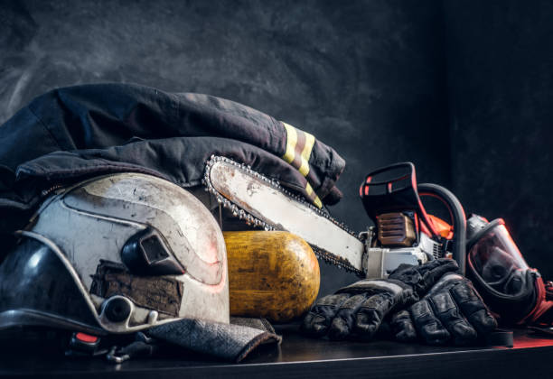 istock Safety unform on the table with respirator and chainsaw. 1171674026
