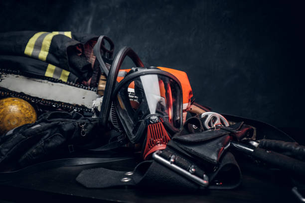 istock Safety unform on the table with respirator and chainsaw. 1171674309