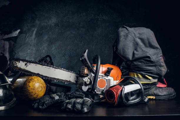 istock Chainsaw, oxygen mask, and safety gear on the table 1171674461