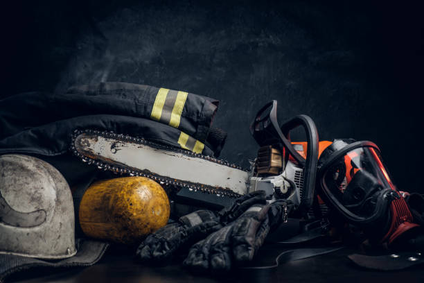 istock Chainsaw, oxygen mask, and safety gear on the table 1171674786