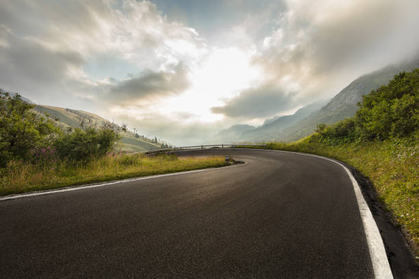istock Asphalt road in Dolomites in a summer day. 1171674900