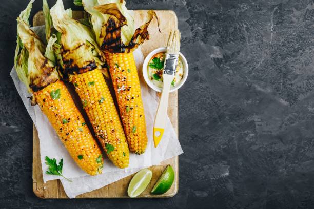 istock Roasted or grilled sweet corn cobs with garlic butter and lime. 1171674938
