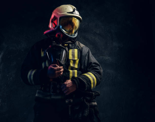 istock Manly firefighter in helmet looks sideways 1171675703