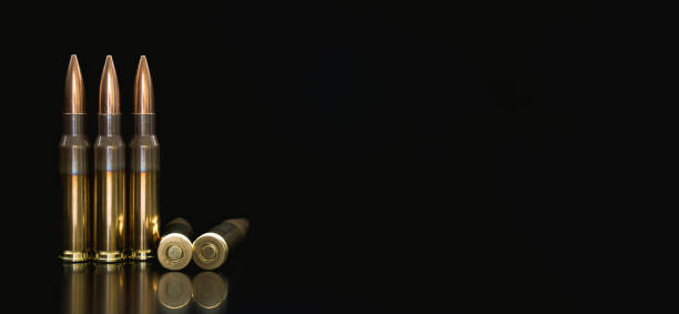 istock Bullet isolated on black background with reflexion. Rifle bullets close-up on black back. Cartridges for rifle and carbine on a black. 1171676195