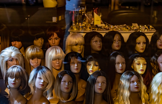 Mannequins Wearing Colorful Wigs in Window of Wig Shop on Cours Gambetta in the French city of Lyon.