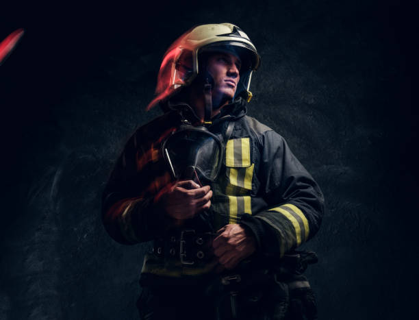 istock Manly firefighter in helmet looks sideways 1171677979