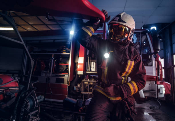 istock A fireman wearing a protective uniform with flashlight included working in a fire station garage 1171679932