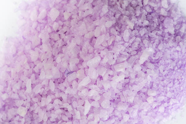 Lavender salt natural spa products and decor for bath on white background.