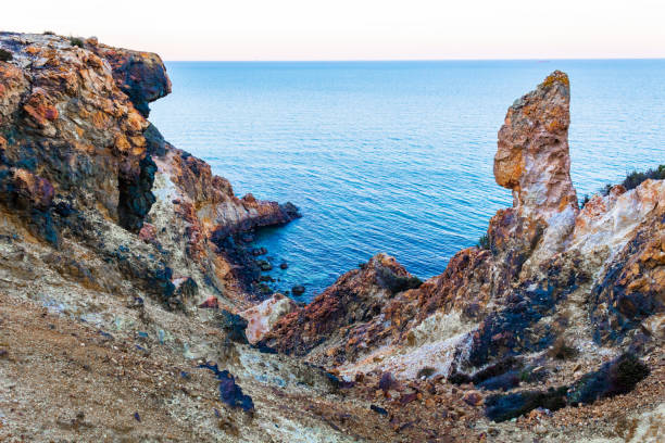 istock Exotic cliff rock, background sea 1171683811
