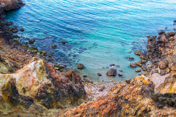 Exotic cliff rock, background sea Light brown color rocks and cliff, waves hitting the rocks lagün stock pictures, royalty-free photos & images