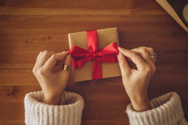 istock Woman holding a gift box 1171685352