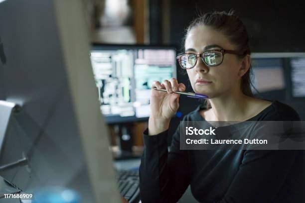 Woman Monitors Dark Office Stock Photo - Download Image Now - Data, Analyzing, Surveillance