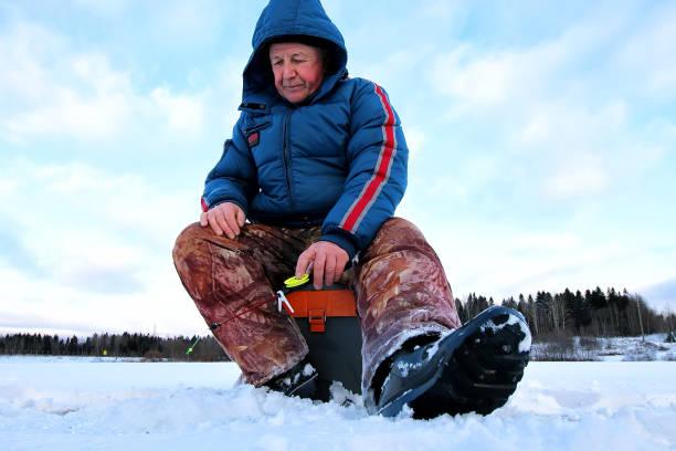 istock Fisherman Winter on the Lake 1171687408