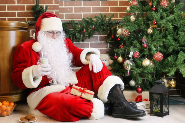 istock Santa Claus with gifts Christmas tree 1171687537