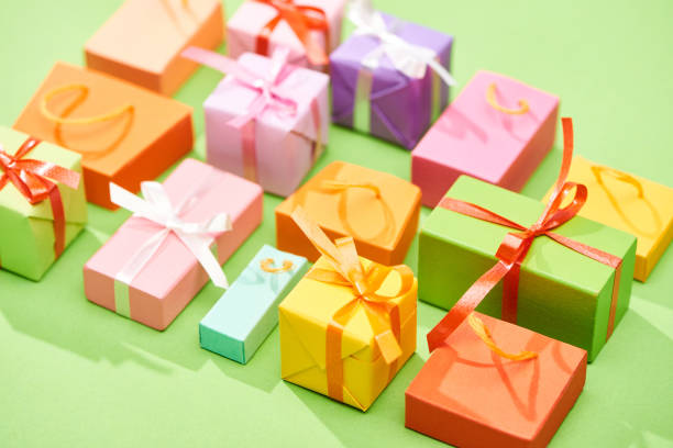 istock selective focus of decorative colorful gift boxes on green background 1171690335