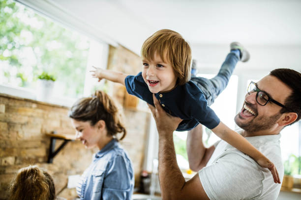istock Happy boy having fun with his father in the kitchen. 1171690478