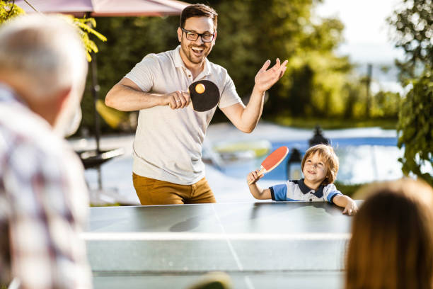 istock Playing table tennis in the backyard! 1171690663