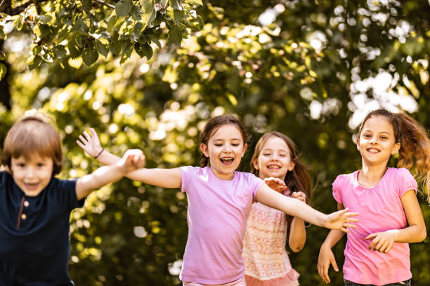 istock Carefree kids having fun while running in the park. 1171690832