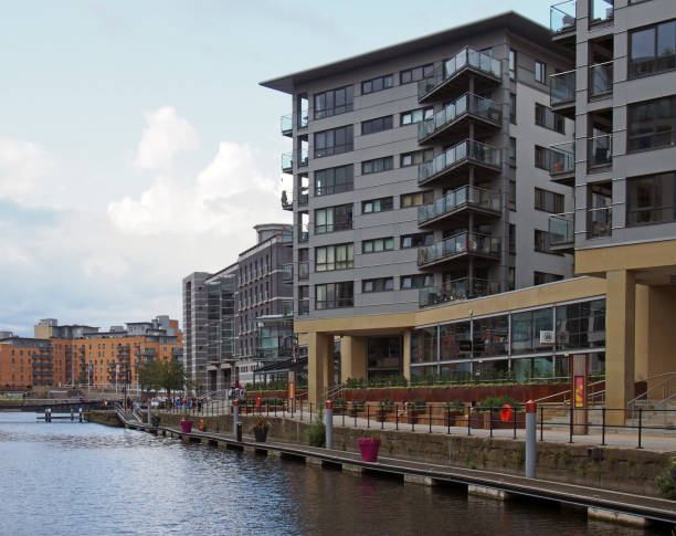 a view of of leeds dock with modern apartment developments and bars next to the waterfront - leeds england yorkshire canal museum imagens e fotografias de stock