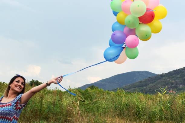 istock Women with balloons 1171692620