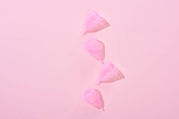 istock top view of pink plastic menstrual cups on pink background 1171694020