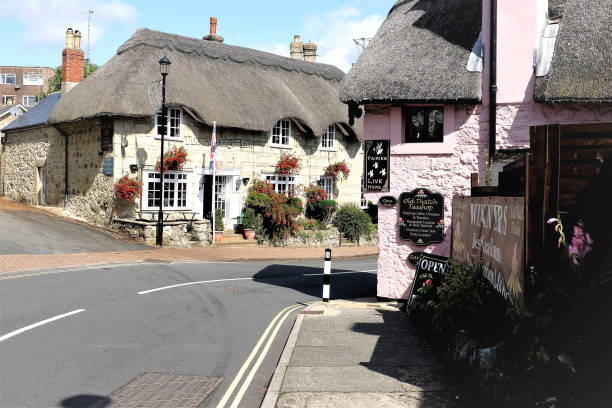 Shanklin, Isle of Wight, UK, August 15, 2019. The village Inn and the old thatch teashop stand on a corner of the main road of the old thatched village of Shanklin on the Isle of Wight, UK.