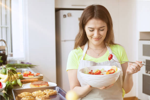 istock young woman in the kitchen 1171698370