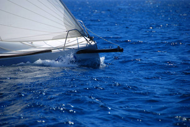 Front view of Sailboat racing at regatta