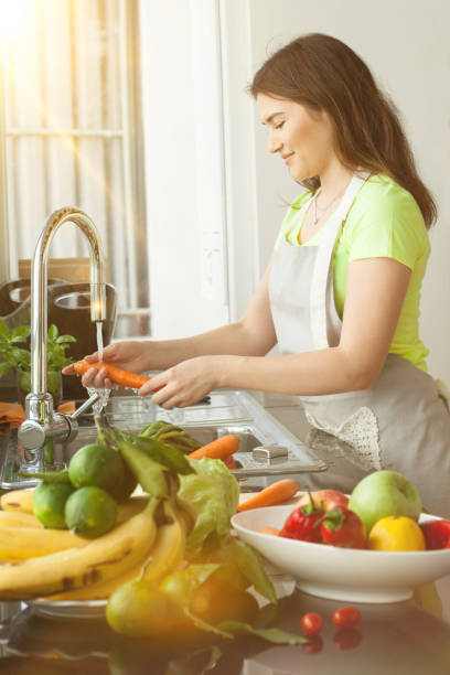 istock young woman in the kitchen 1171698480