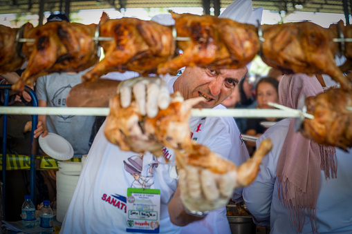 Mengen, Bolu/Turkey - August 03 2019 :  34 nd Mengen Culinary and Tourism Festival (34. Mengen Ascilik ve Turizm Festivali in Turkish).  Longest chicken flipping Guinness record attempt. Free chicken.