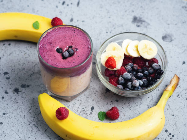 istock double-layered cocktail smoothie with banana, blueberries and raspberries 1171700595