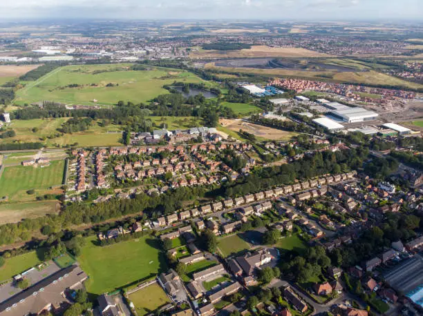 Aerial photo of the UK town known as Pontefract, located in Wakefield West Yorkshire, showing typical British housing estates with roads and paths.