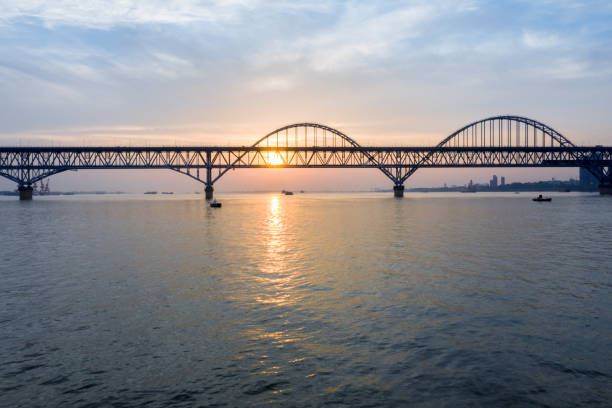 istock jiujiang yangtze river bridge in sunrise 1171702943