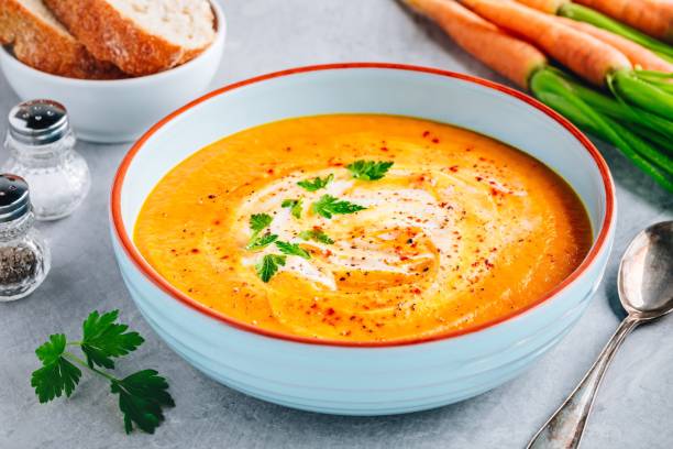 istock Carrot and pumpkin cream soup with parsley 1171703298