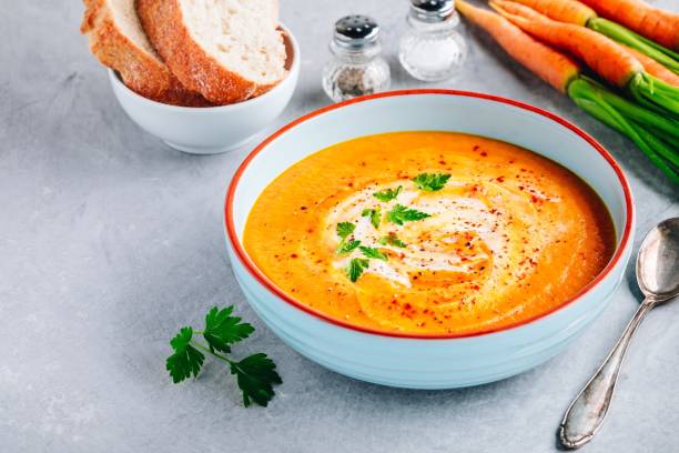 istock Carrot and pumpkin cream soup with parsley 1171703325