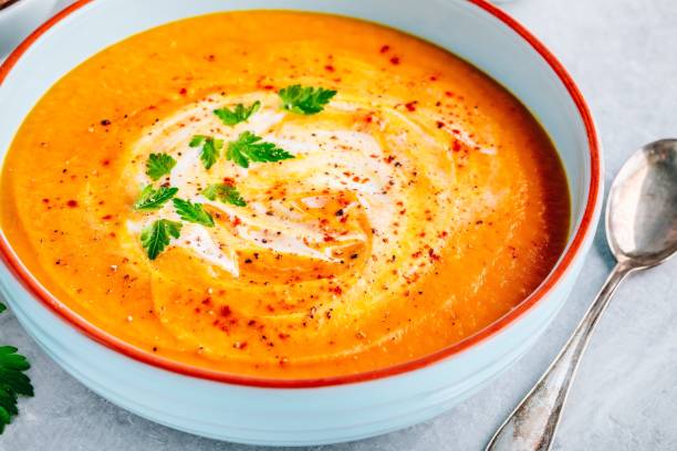 istock Carrot and pumpkin cream soup with parsley 1171703429