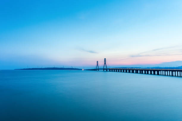 istock beautiful poyang lake and cable-stayed bridge at dusk 1171704606
