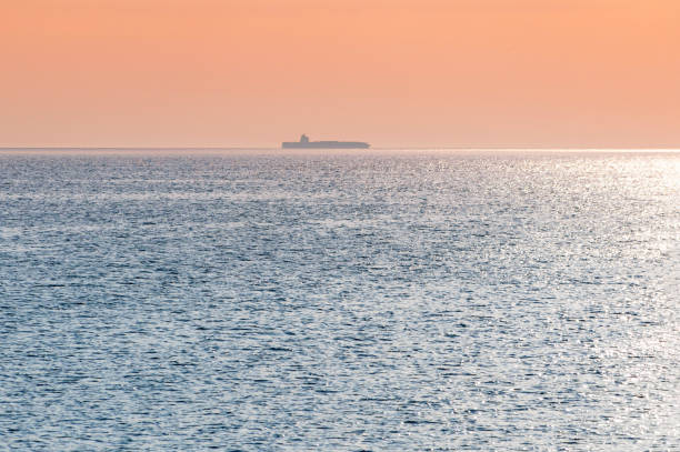 istock Barge at beautiful sunset. Anchorage for ships, copy space. Amazing evening seascape, breathtaking travel view. 1171704843