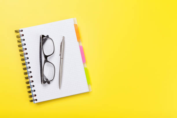 istock Office yellow workplace backdrop with supplies 1171706485