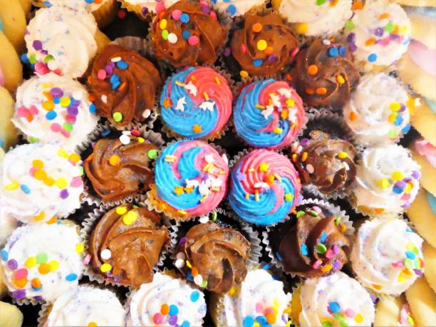 istock Decorated Cupcakes for Parties and Celebrations With Colorful Sprinkles and Icing 1171707039