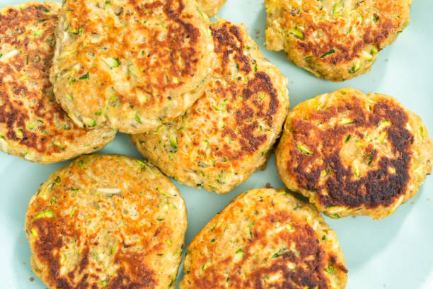 istock Fresh fried zucchini cakes on a plate. 1171709329