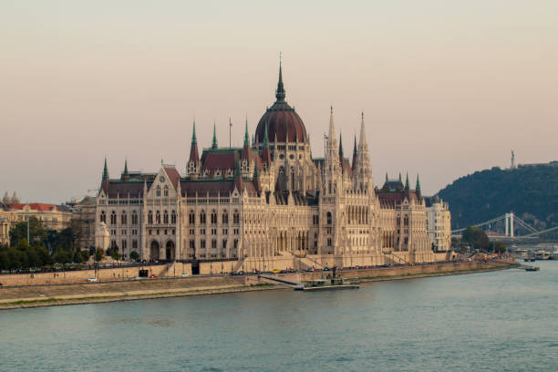 Dusk from the Margaret Bridge in Budapest: Sights of the capital on the Danube Dusk from Margaret Bridge in Budapest: sights of the capital on the Danube margitsziget stock pictures, royalty-free photos & images