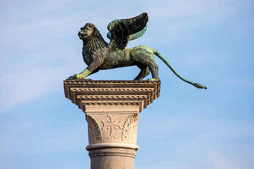 The column in the Piazzetta di San Marco with a sculpture of the Lion of Venice on top of it, in Venice, Italy.