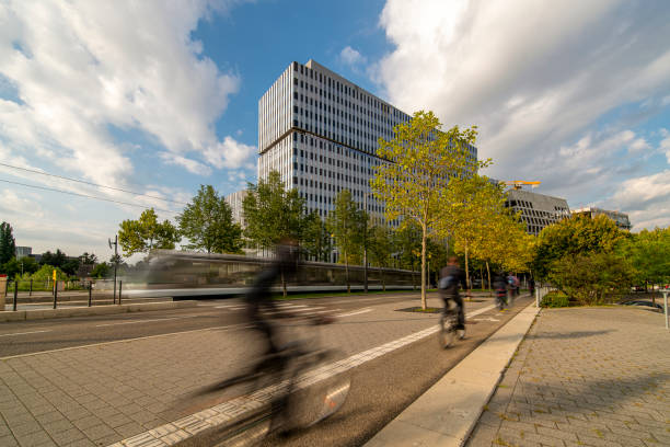 Blured commuters in front of urban modern business building