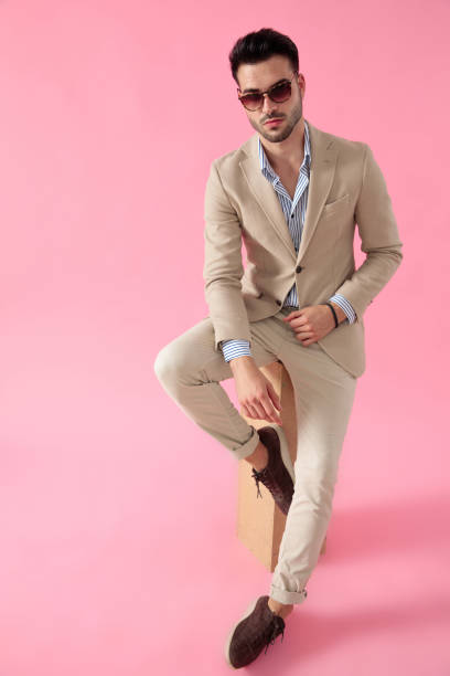 istock smart casual man seated on a wooden box 1171716751