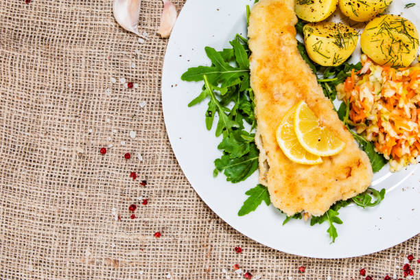 istock Fried cod fillet with French fries and vegetables 1171716951