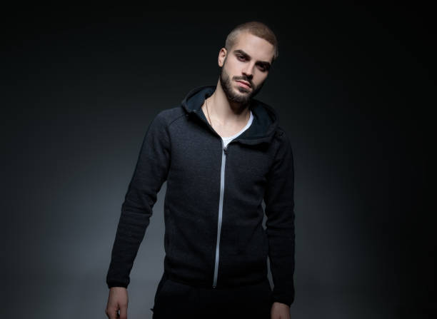 istock male model wearing hoodie and posing 1171717549