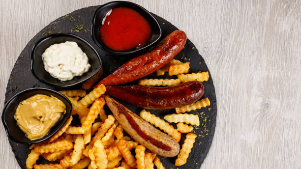 istock Delicious sausage served with fries 1171717619