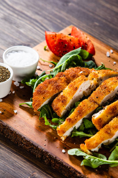 istock Fried pork chop with mushroom and vegetable salad on white background 1171718553