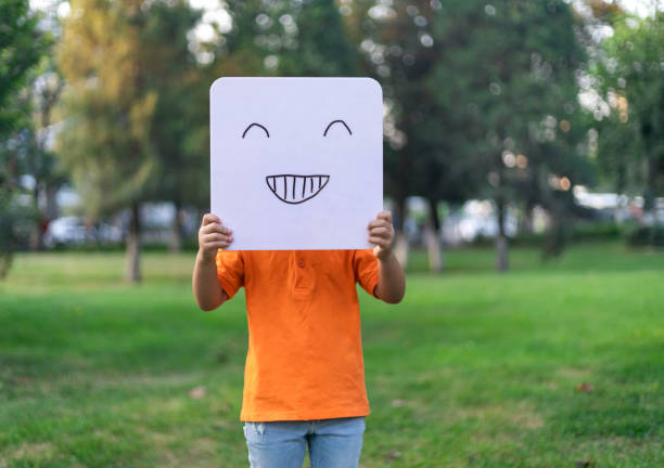 Girl Holding a Whiteboard Facial Expression : laughing